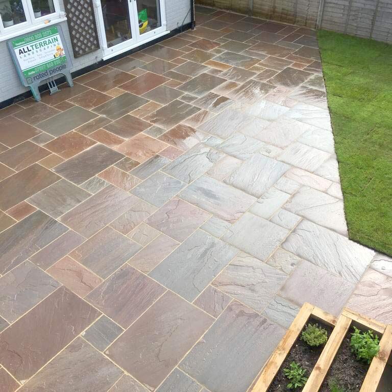 The finished Indian Sandstone Patio surrounding the house. New Patio, Turfing & Garden Landscaping, Croydon