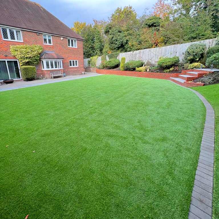 Artificial Grass & Garden Landscaping, steps and retaining wall, Banstead, Surrey. All Terrain Landscaping, Morden