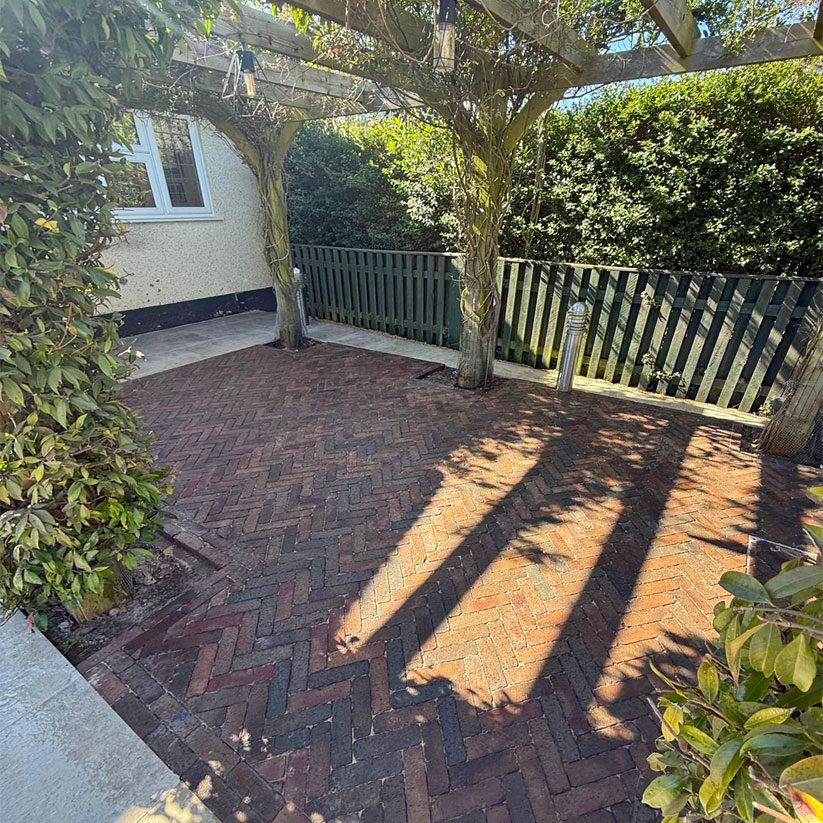 Porcelain and Clay Paver Patio with Metal Pergola, Cheam Village, Sutton. All Terrain Landscaping