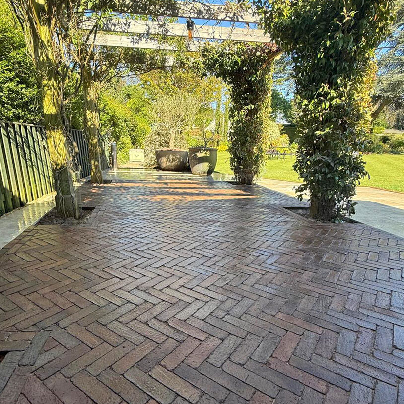Porcelain and Clay Paver Patio with Metal Pergola, Cheam Village, Sutton. All Terrain Landscaping