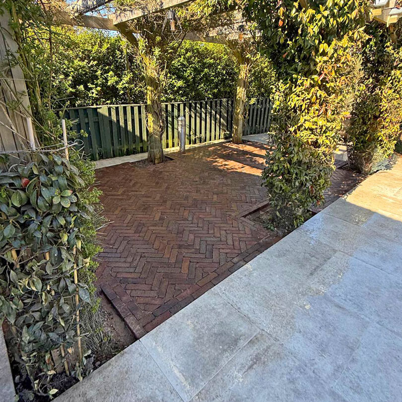 Porcelain and Clay Paver Patio with Metal Pergola, Cheam Village, Sutton. All Terrain Landscaping